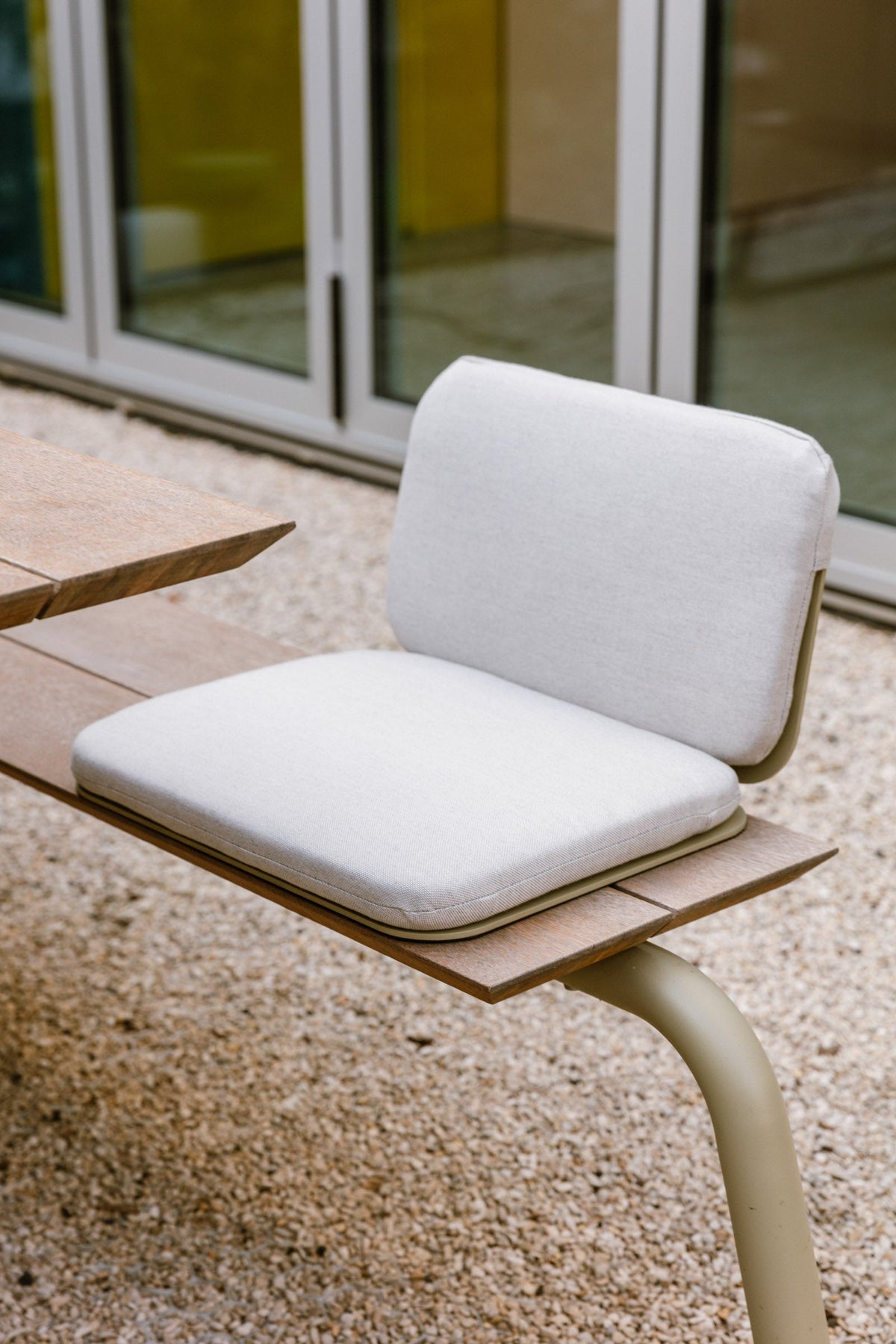 Light outdoor cushion with seat and back support on a garden bench, from the Dutch Garden collection